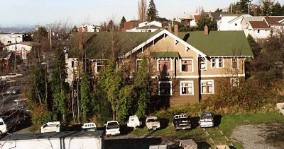 kulshan crop pre fairhaven gardens Cars parked on empty lot that is now Fairhaven Gardens